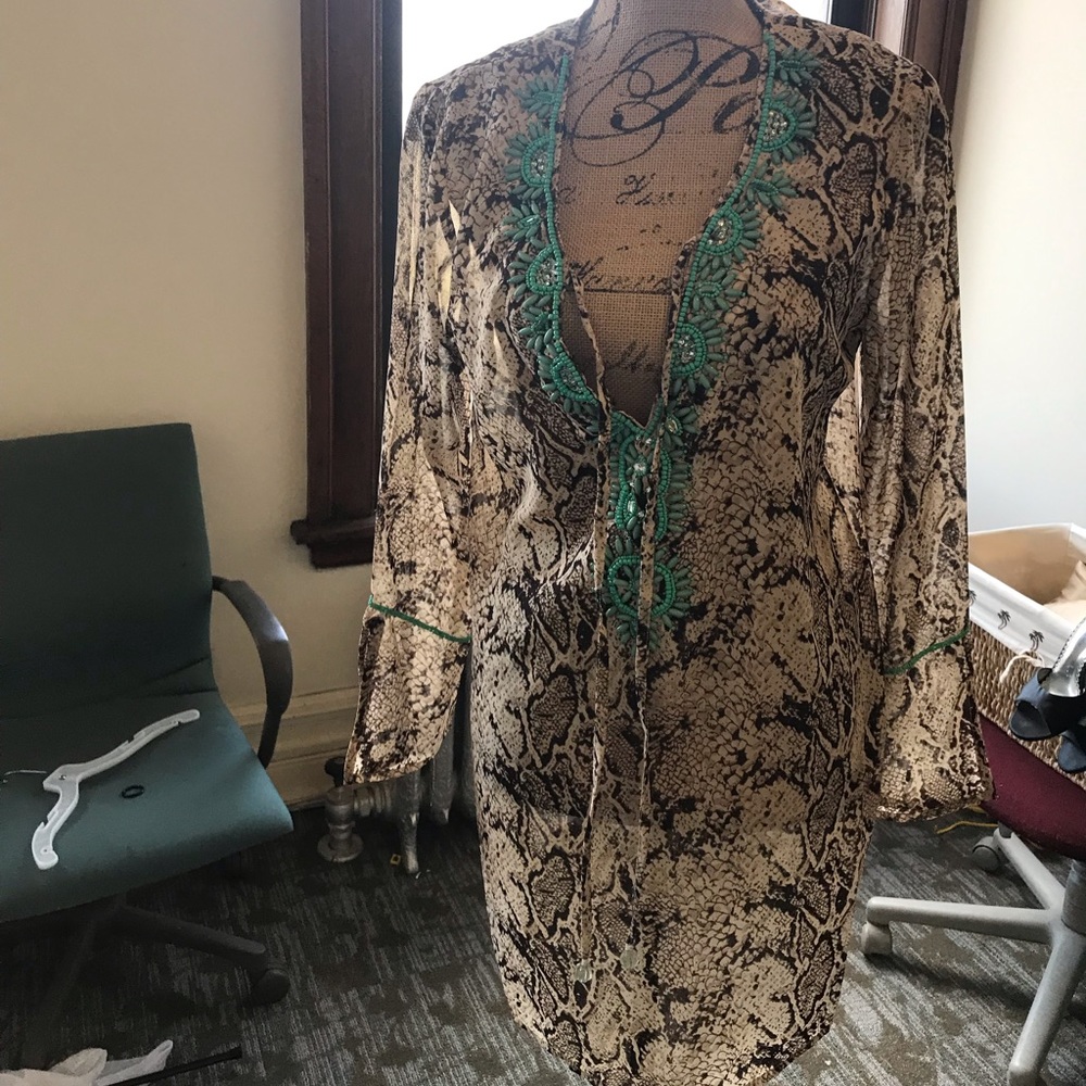 Sexy coverup/ tunic w/ beautiful detail neckline. Elegant and trendy